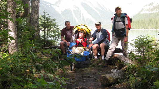 Family posing in a forest with a WIKE bicycle trailer.